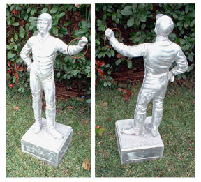unpainted lawn jockey statue