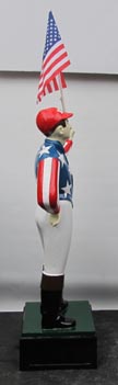 horse racing jockey statue red stripes blue stars horse racing jockey holding American flag